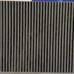 سلسلة ديكور فاخرة من الخشب الداكن مع خطوط أنيقة وتصميم حديث.